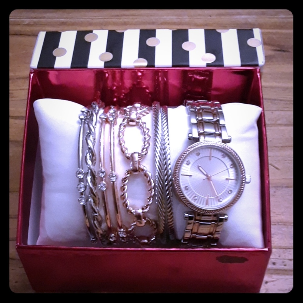 8 piece watch and bracelet set.
